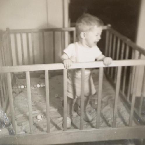 Bobby dislikes his playpen, November 1948.