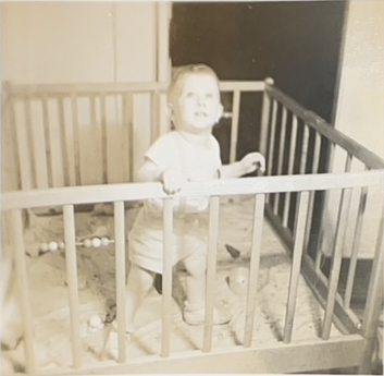 Maybe the playpen is growing on him? November 1948
