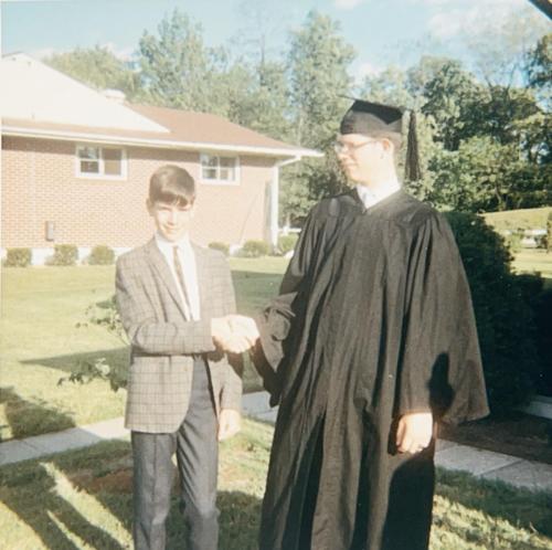 On his graduation day, Robert shakes Randy's hand, June 10, 1966.