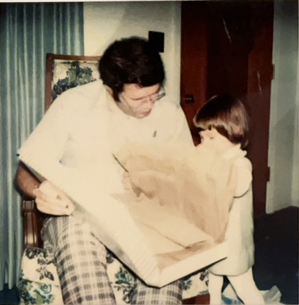 Bob turns 30, and Andrea, age 2, helps him open gifts, at the Smiths' home in Clarksville, Tennessee, November 24, 1977.