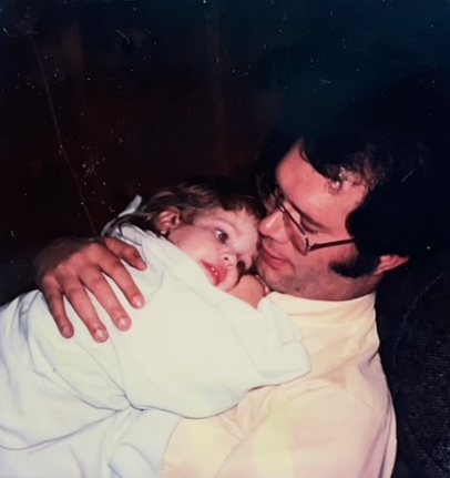 Bob snuggles 2-year-old Ashley, December 1981.