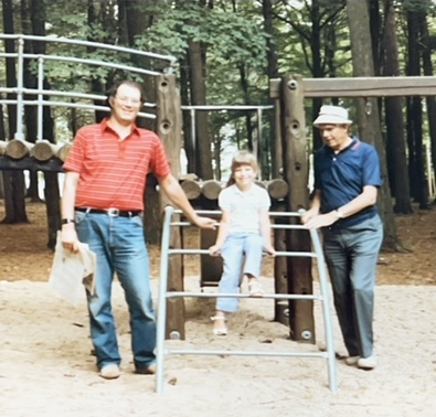Bob, Ashley, and Gus visit a favorite playground in Cadillac, Michigan, July 1985.