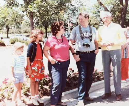Hultmans enjoying a sunny day in Frankenmuth, Michigan, waiting for the glockenspiel: Ashley, Andrea, Beckie, Bob, and Gus, July 1986.