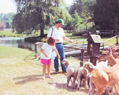 Ashley and Bob love feeding sheep and deer at Johnny's Farm outside Cadillac, Michigan, July 1989.